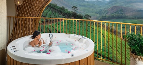 Glamping stay with a private tub above the tea hills of Vagamon