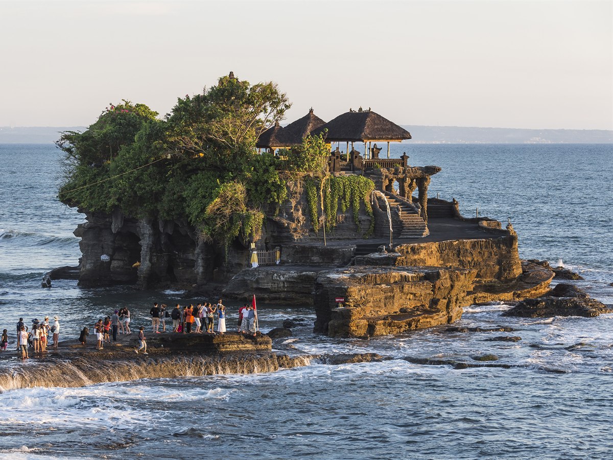 Tanah Lot temple on a sea rock at sunset, Bali, Indonesia