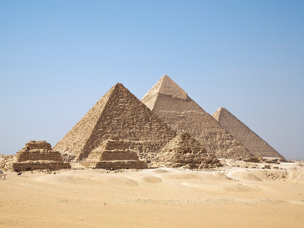 The Great Pyramids of Giza rising from the desert, Egypt