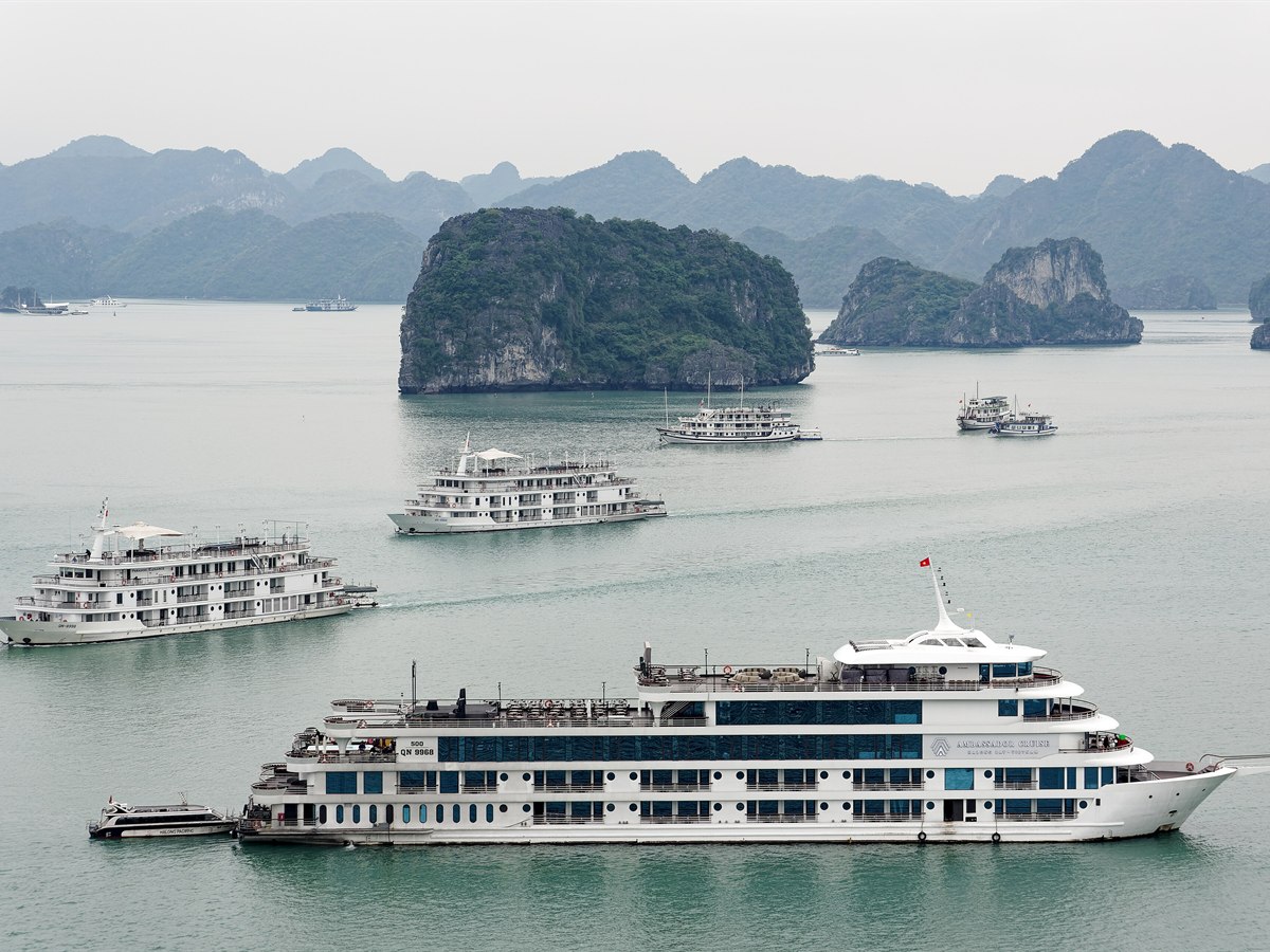 Cruise ships among limestone islands in Ha Long Bay, Vietnam
