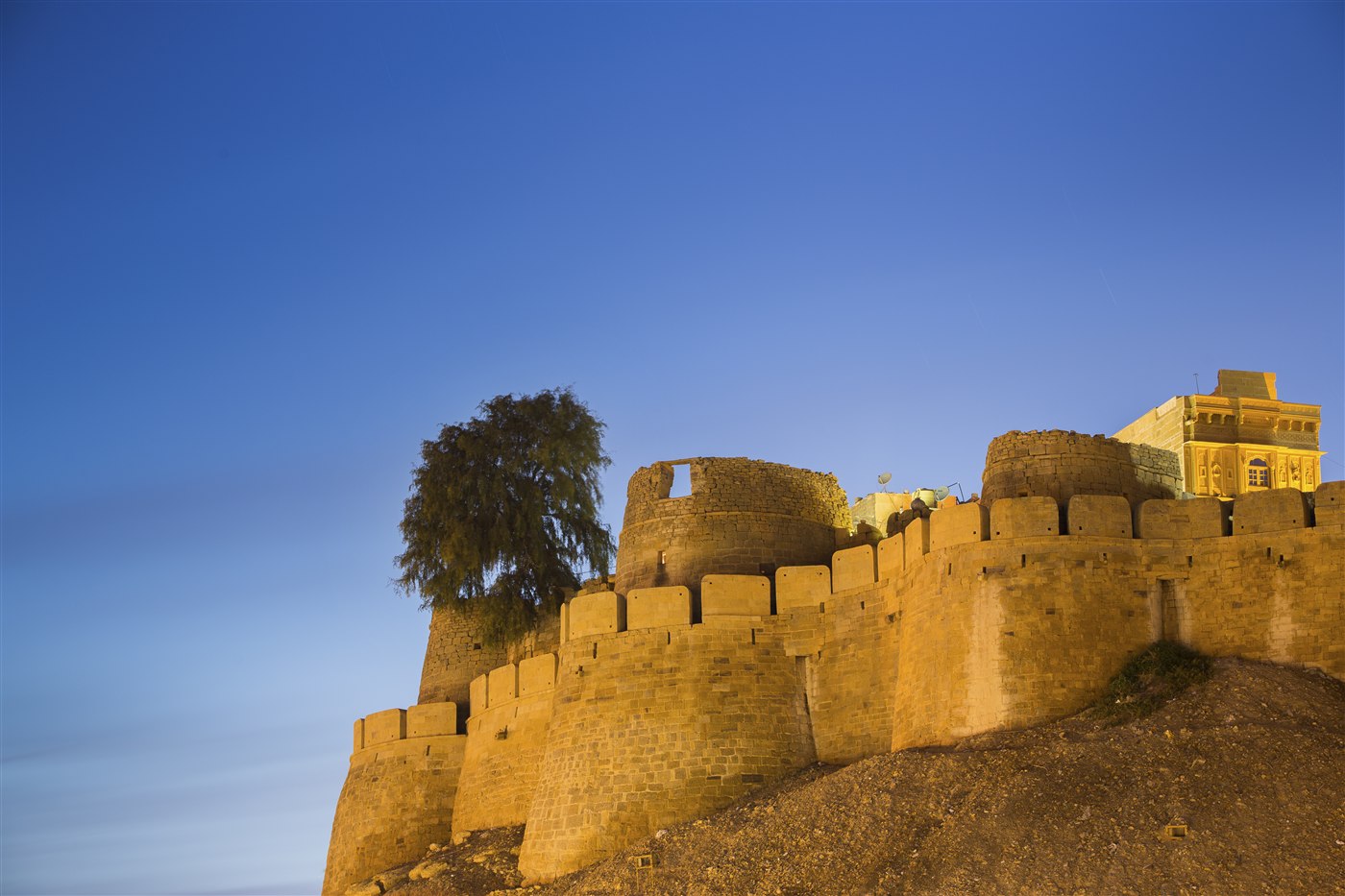 Jaisalmer Fort's sandstone ramparts lit at dusk, Rajasthan