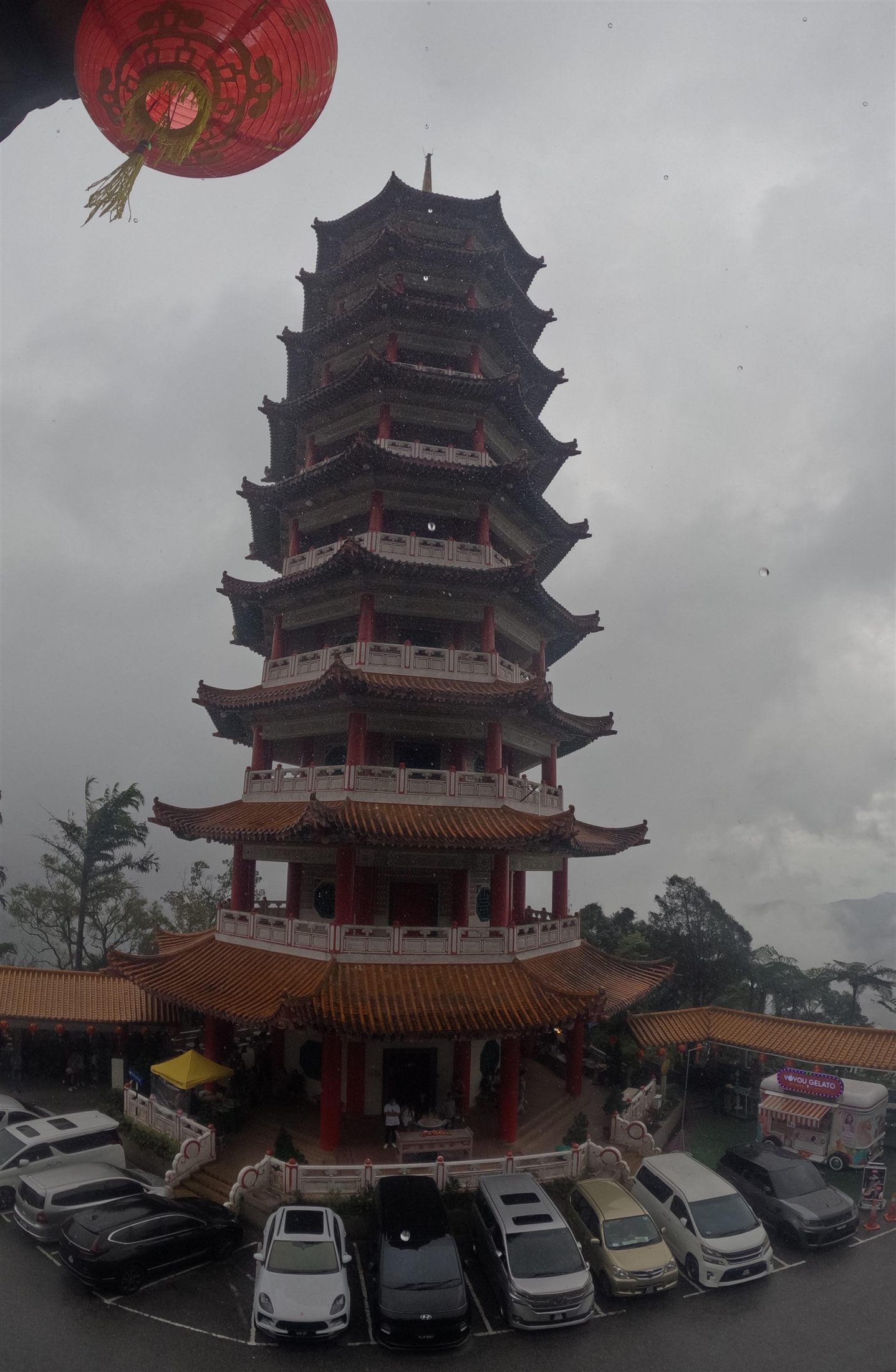 The nine-storey pagoda of Chin Swee Caves Temple among red lanterns at Genting Highlands, Malaysia