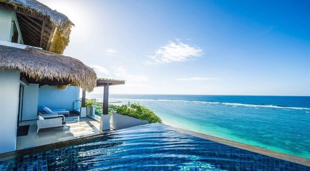 An infinity pool overlooking the reef break off Bali's south coast
