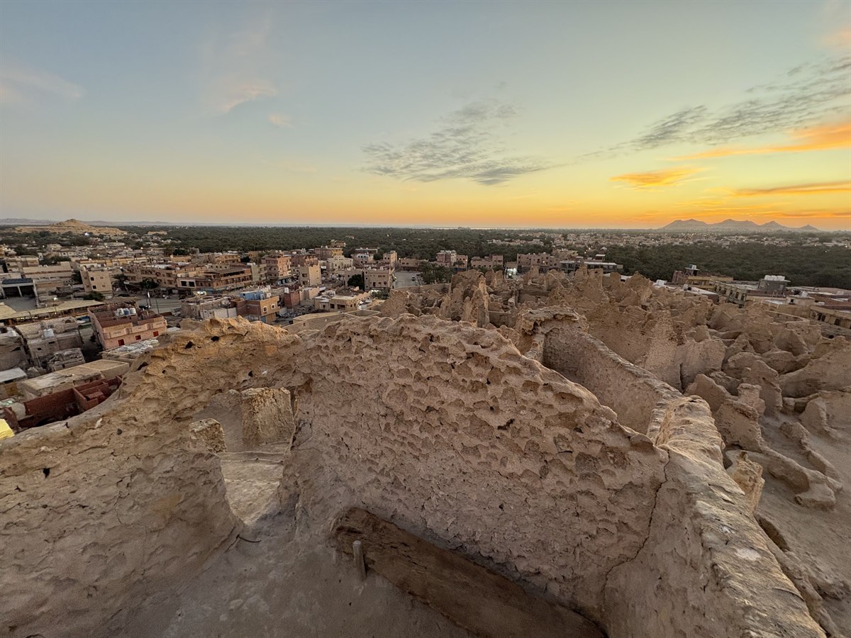 Sunset over Siwa Oasis and its palm groves, seen from the eroded mud-brick walls of Shali fortress, Egypt
