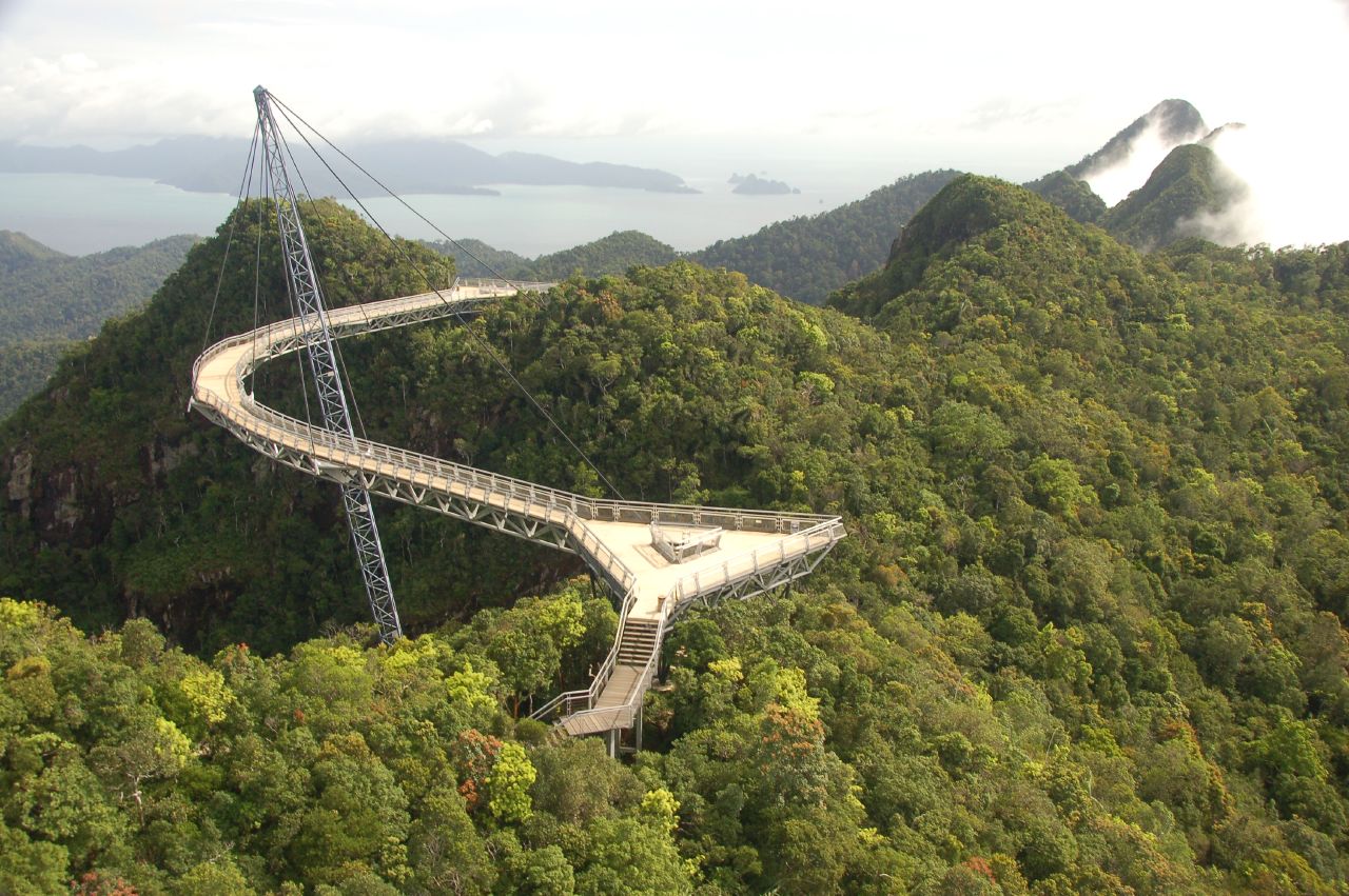 The curved Langkawi Sky Bridge over rainforest with the Andaman Sea beyond, Malaysia