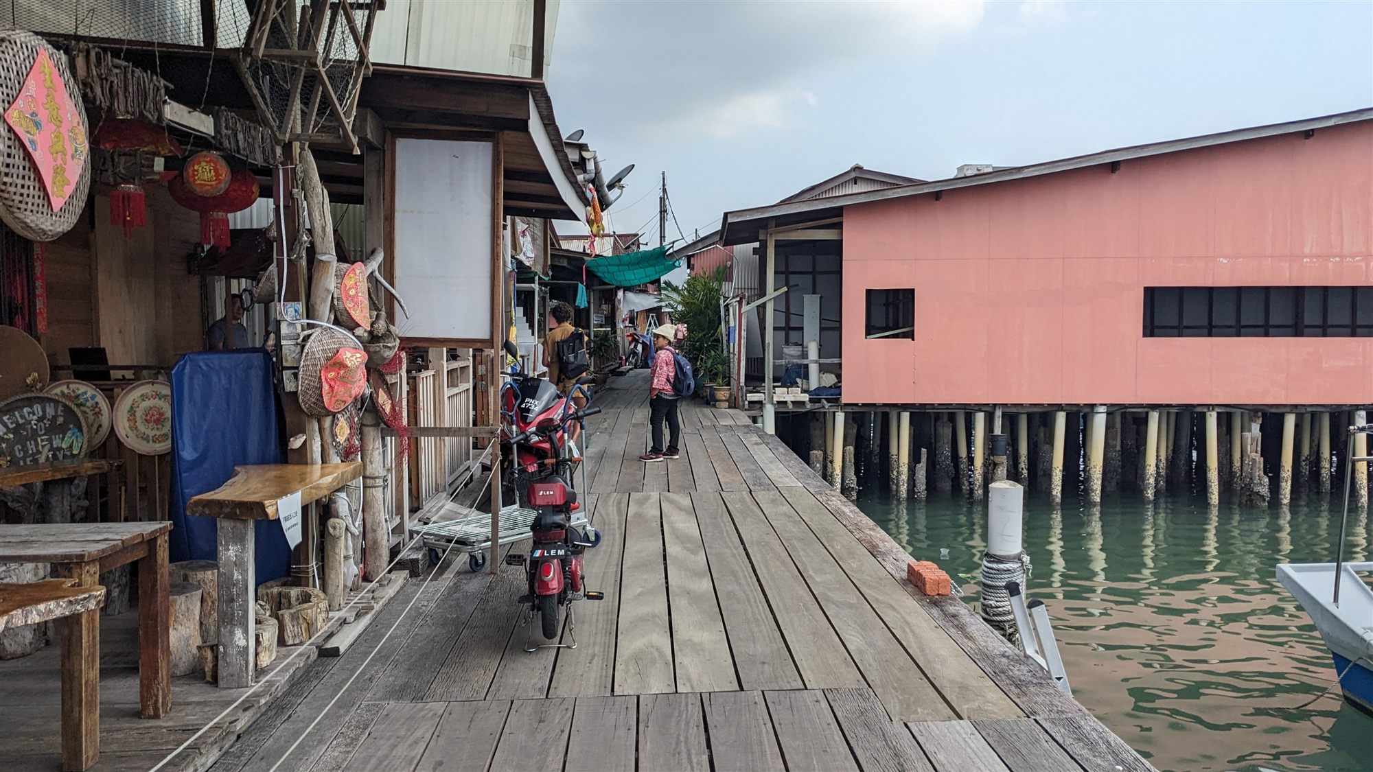 Wooden walkway past stilt houses on Chew Jetty in George Town, Penang, Malaysia