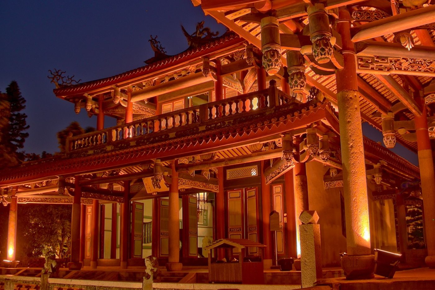 The Wenchang Pavilion at Chihkan Tower lit up at night, with carved eaves and red columns, Tainan, Taiwan