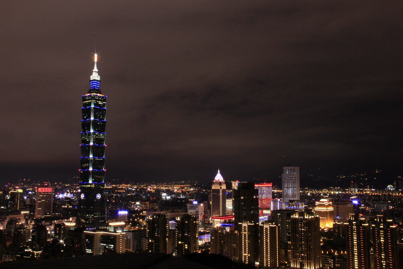 Taipei 101 lit up above the Xinyi district skyline at night, Taipei, Taiwan