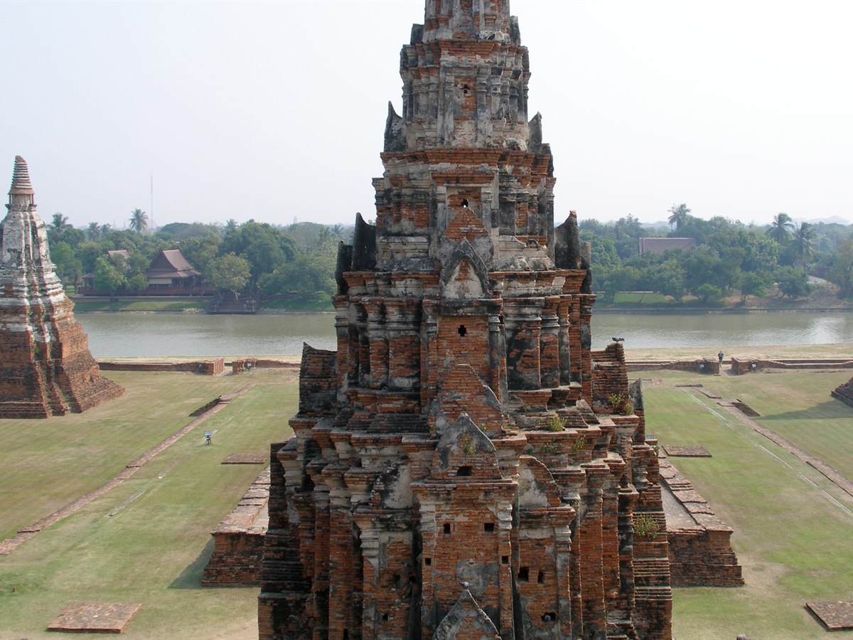 The riverside prang towers of Wat Chaiwatthanaram, a 17th-century Buddhist temple in Ayutthaya Historical Park, Thailand