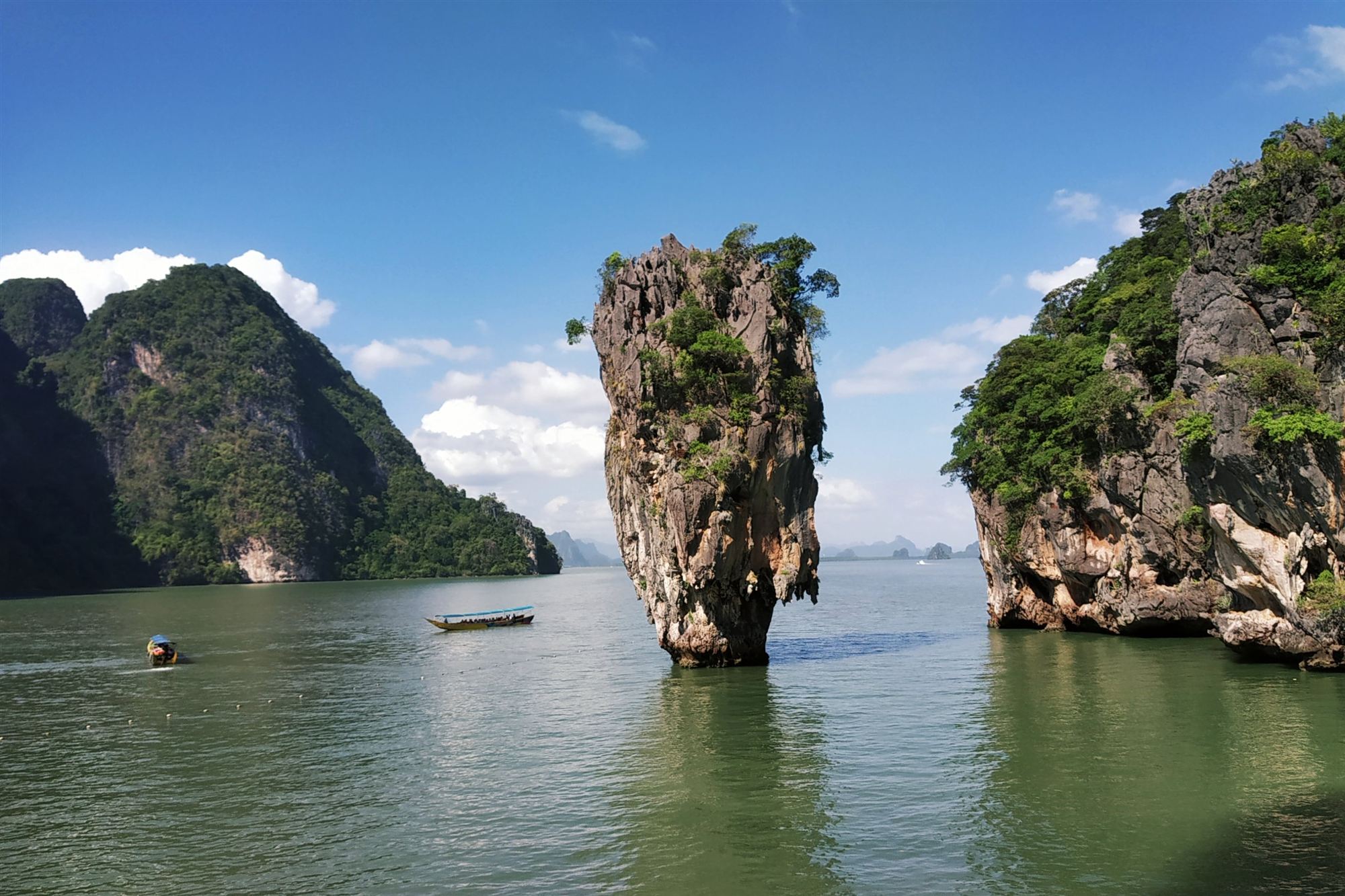 Ko Tapu's limestone spire rising from the calm water of Phang Nga Bay, James Bond Island, Thailand