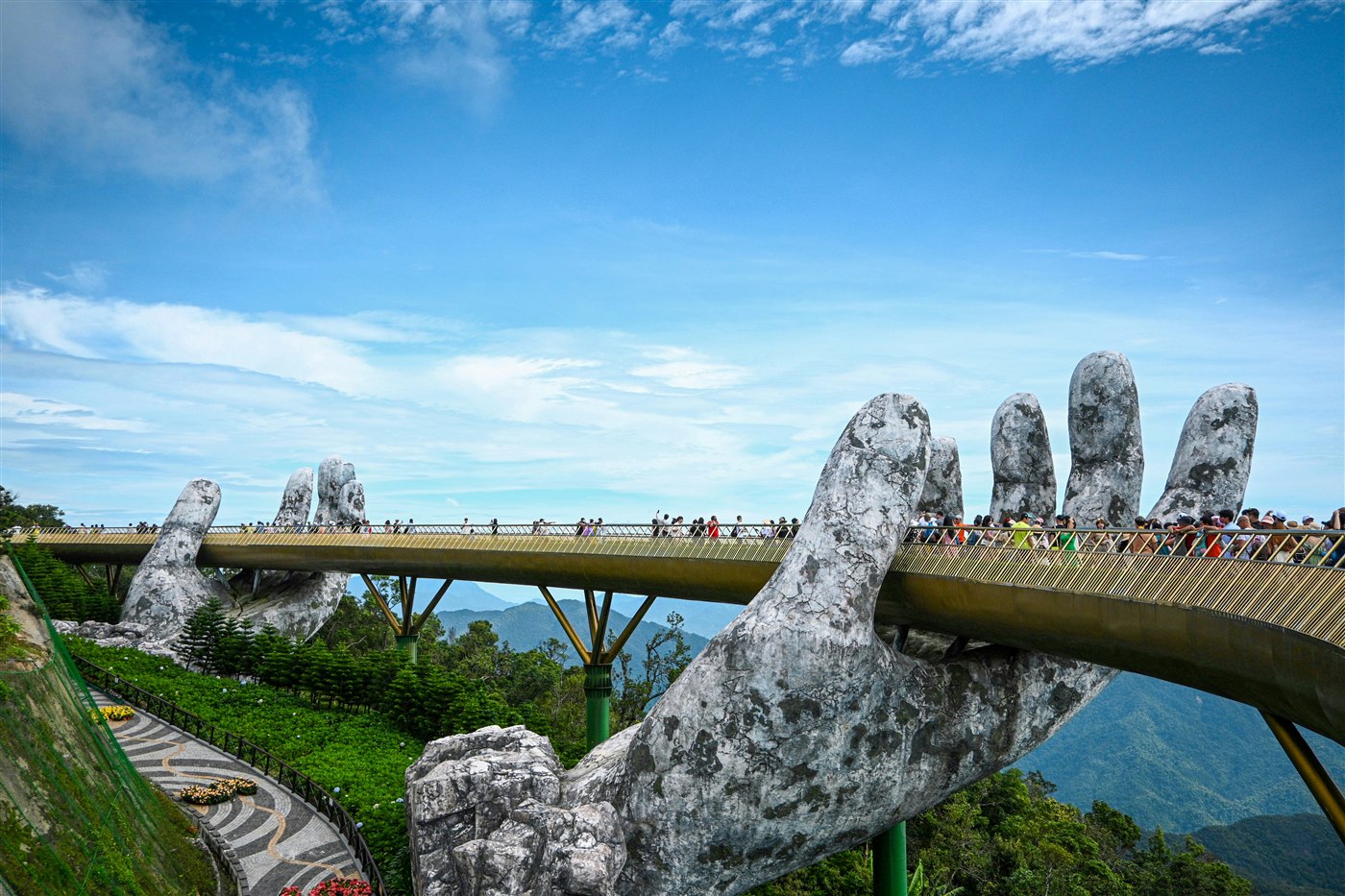The Golden Bridge held up by giant stone hands at Ba Na Hills, Da Nang