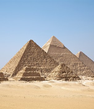 The Great Pyramids of Giza rising from the desert, Egypt