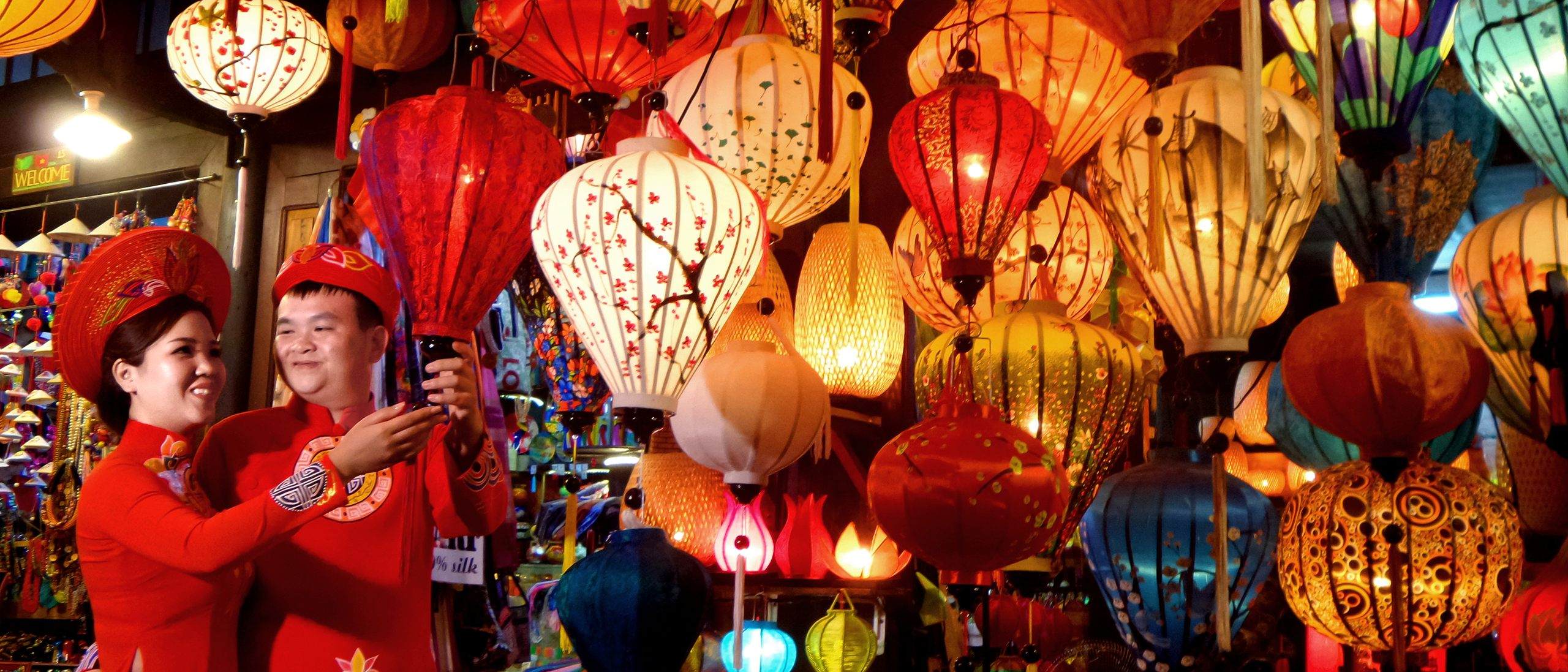 Silk lanterns lit at dusk in Hoi An, Vietnam
