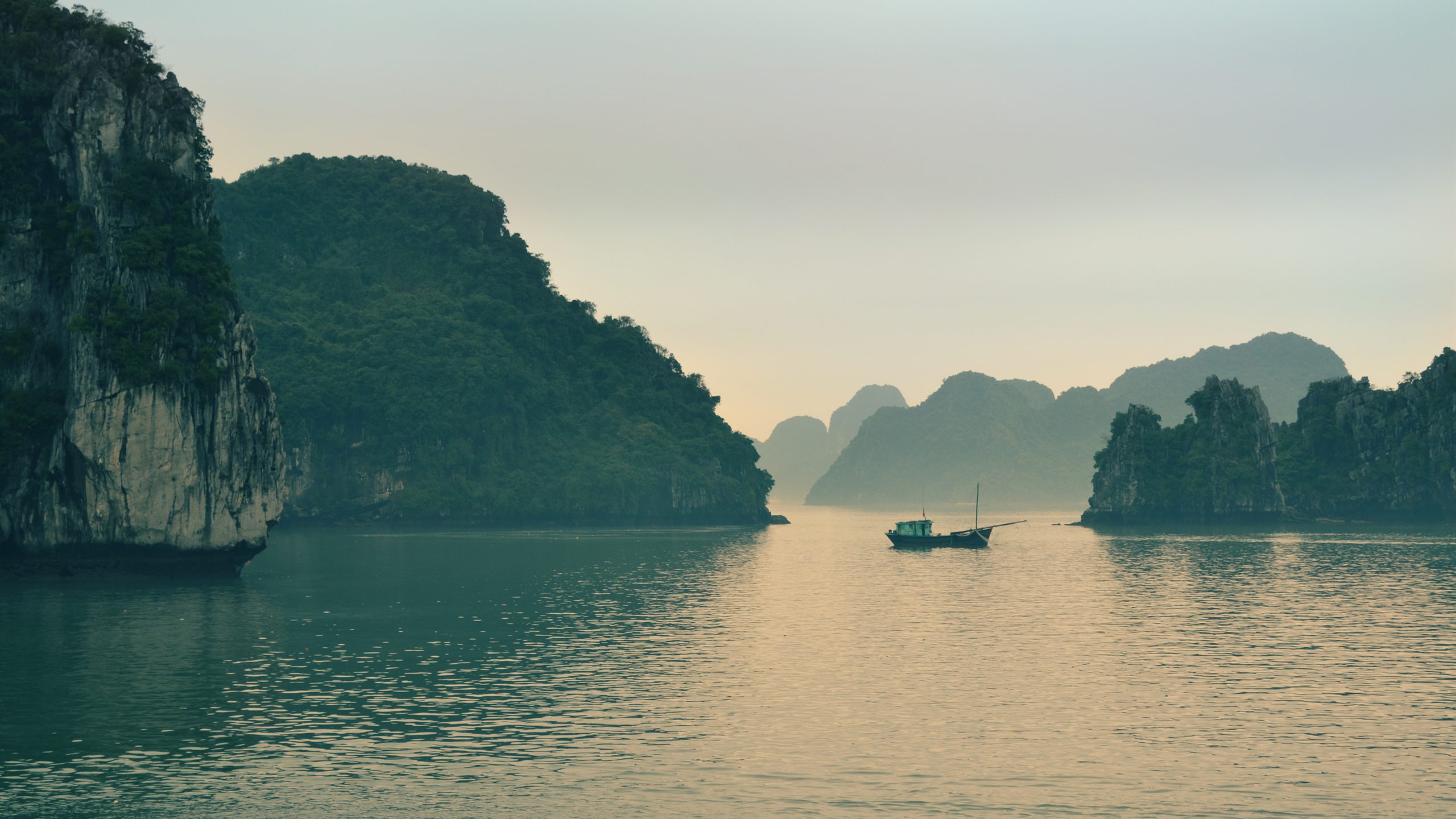 Limestone karst islands of Ha Long Bay at dusk, northern Vietnam